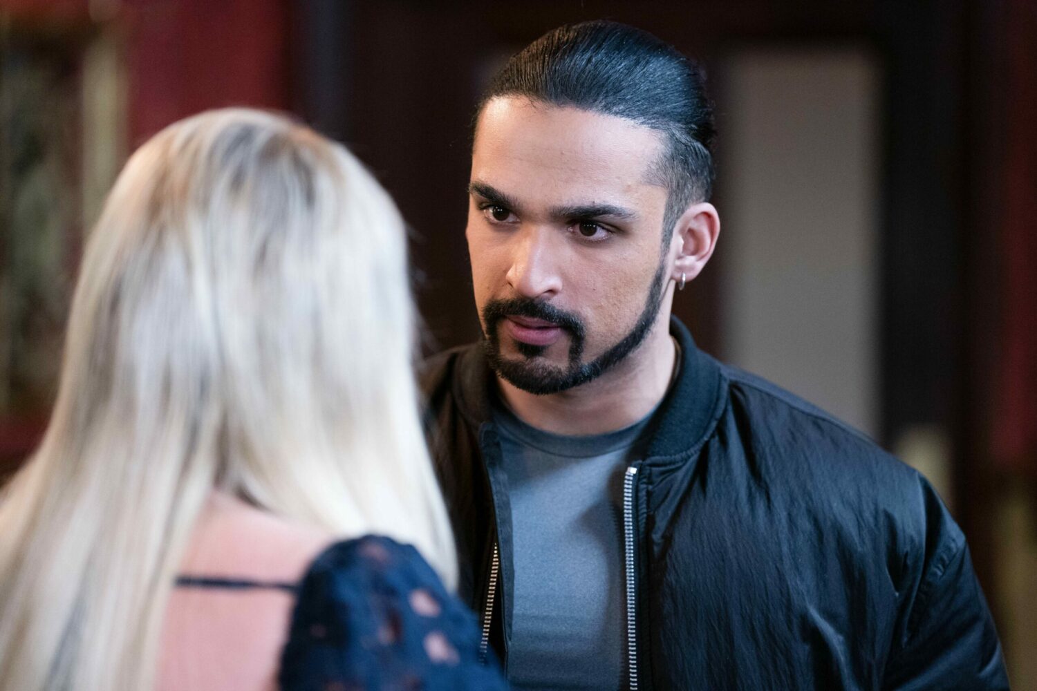 Ravi looks serious as he interrogate Sharon in EastEnders