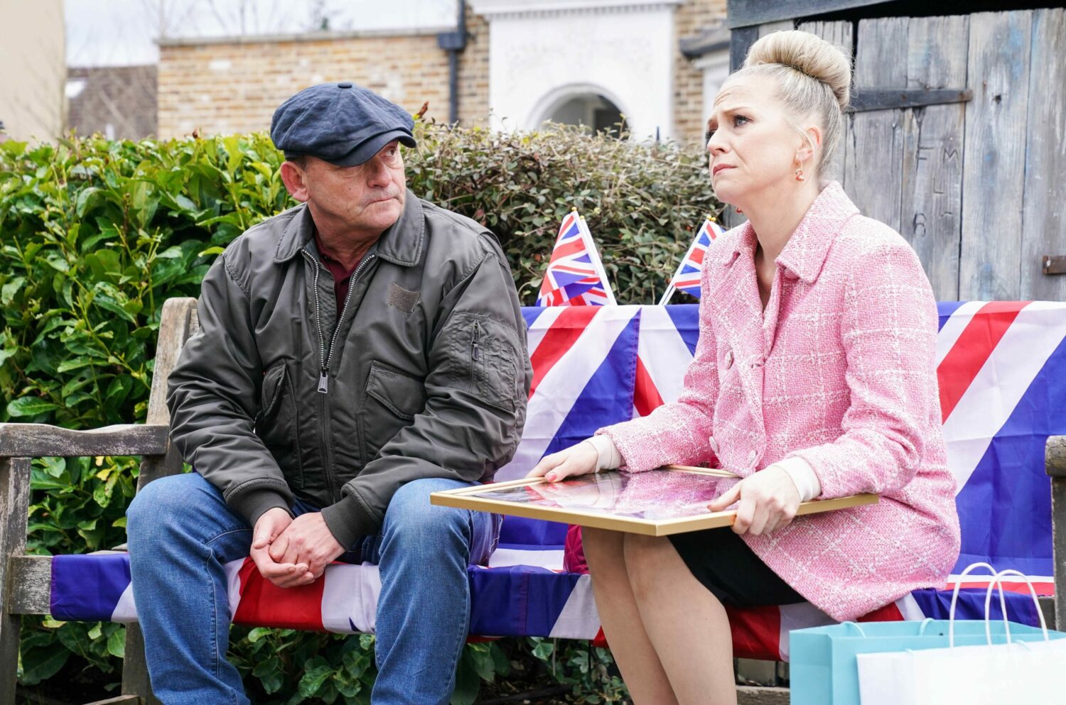 Both upset Billy and Linda talk in EastEnders while sitting on a Union Jack flag