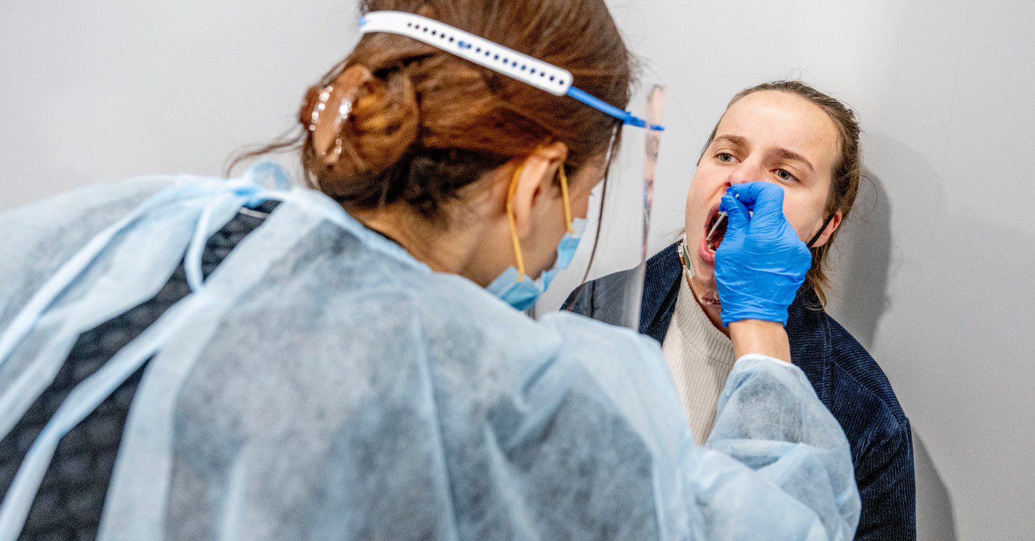 Doctor in scrubs testing for Covid