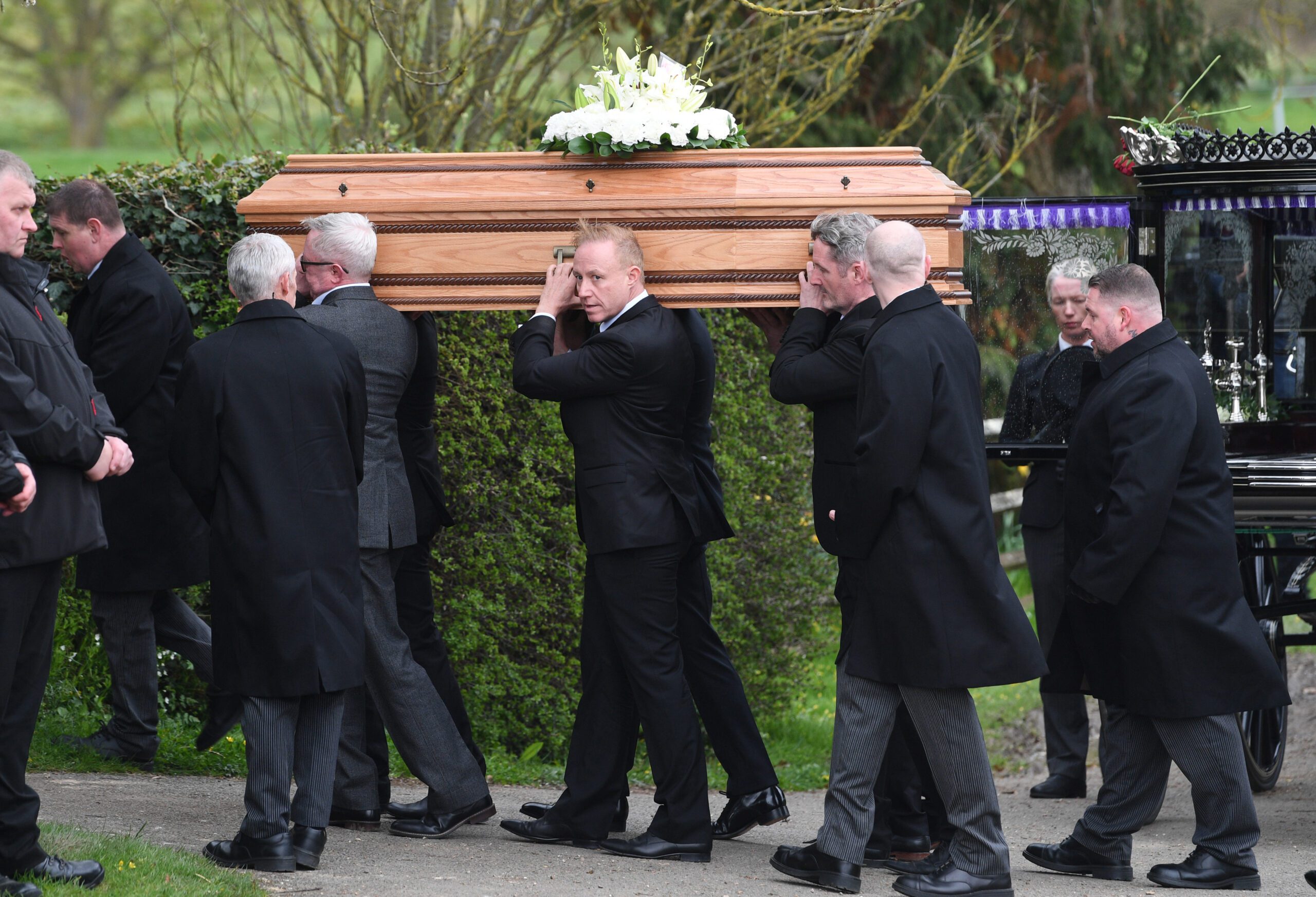 Paul O'Grady's coffin going into the church