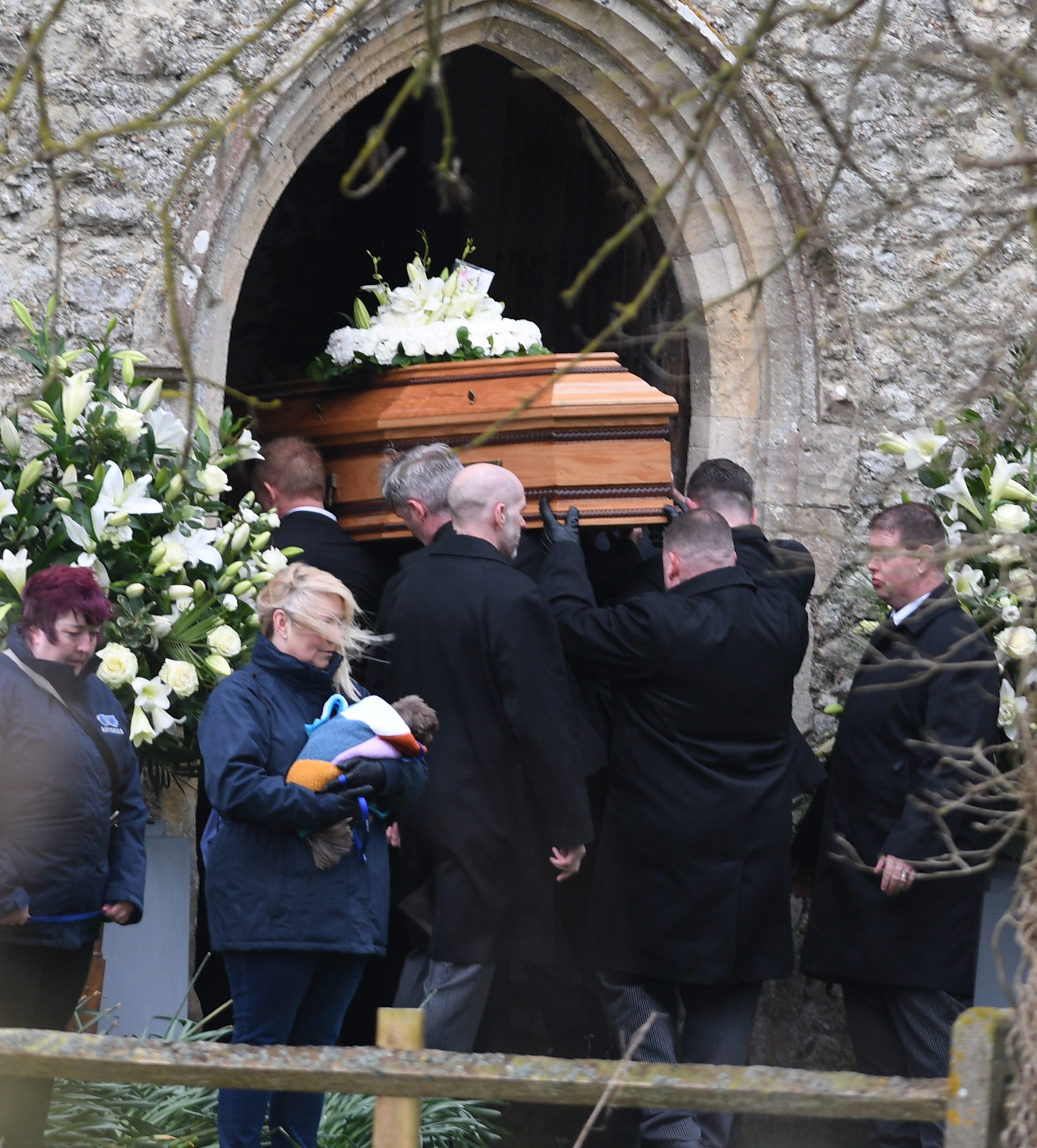 Paul O'Grady's coffin going into the church