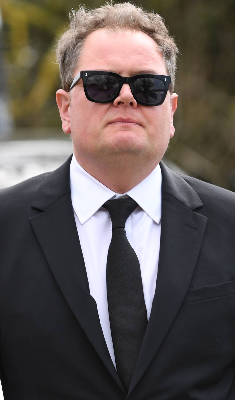Alan Carr attends Paul O'Grady's funeral