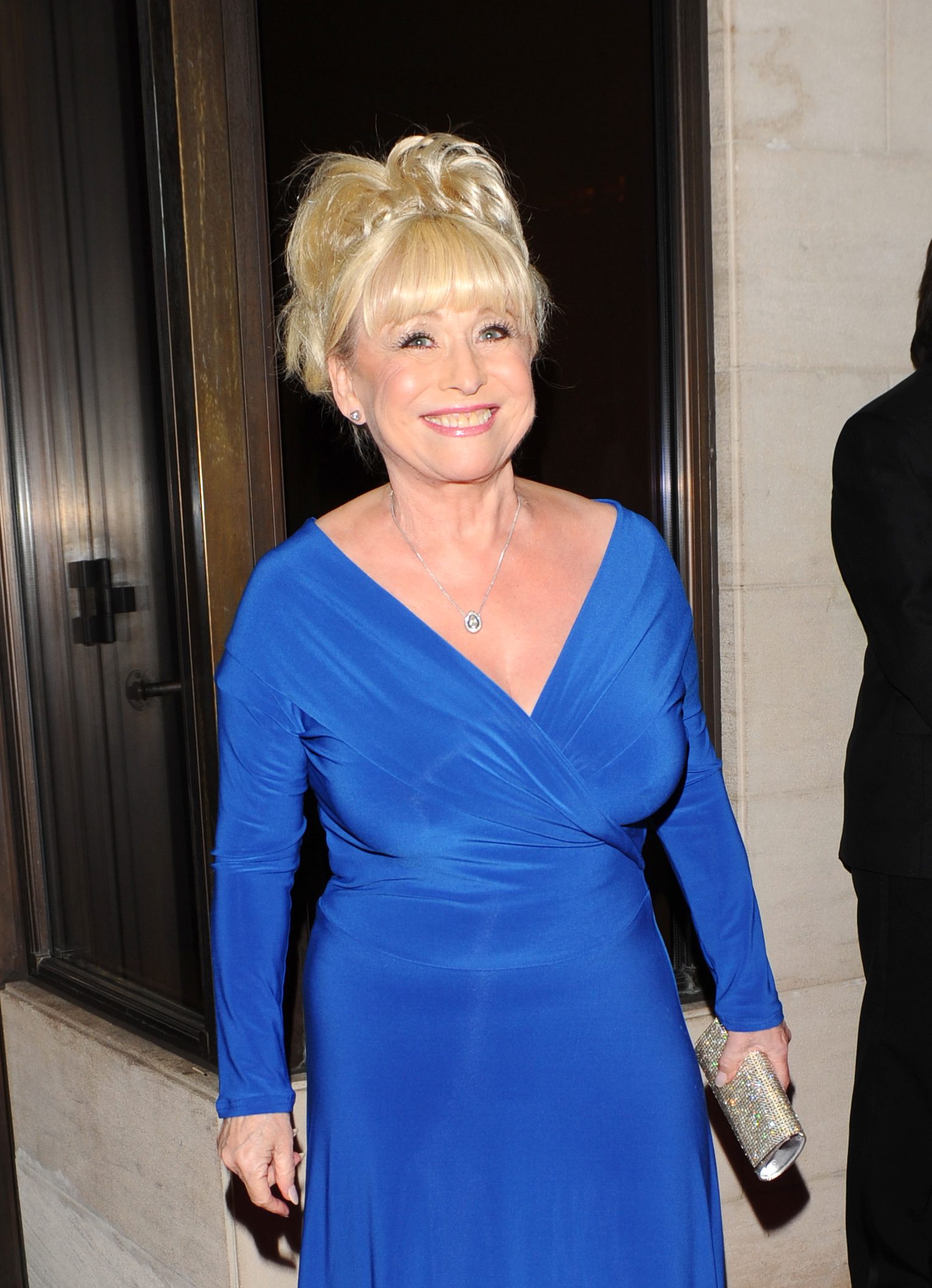 Barbara Windsor wearing a blue dress