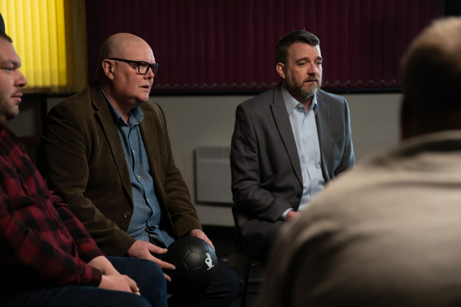 Emmerdale's Paddy is sitting in a Man Club group circle