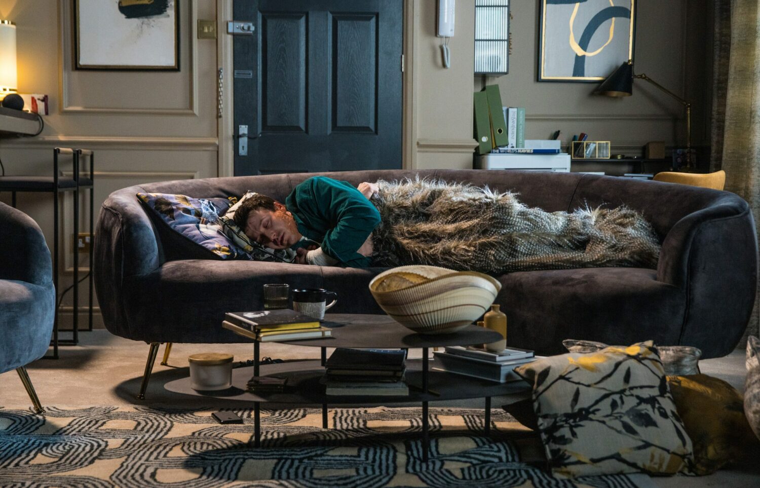 Poorly Ryan lies unconscious on the sofa under a blanket in Coronation Street spoilers