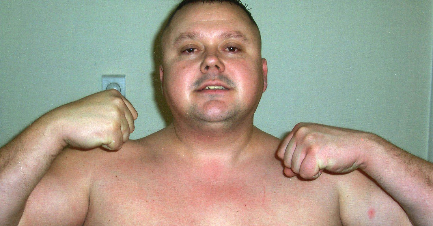 Levi Bellfield topless and flexing 