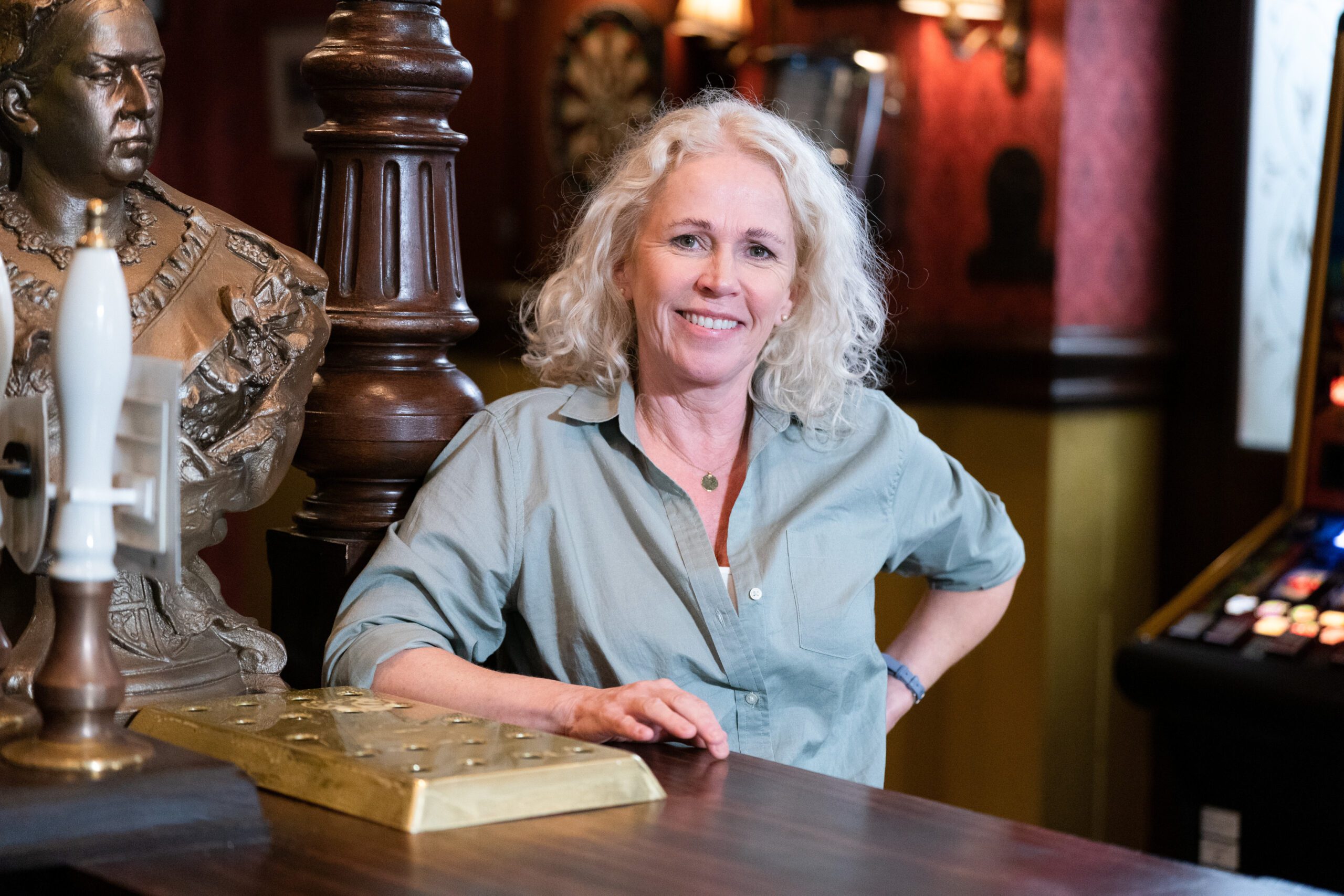 Lisa Fowler poses in the Queen Vic in EastEnders