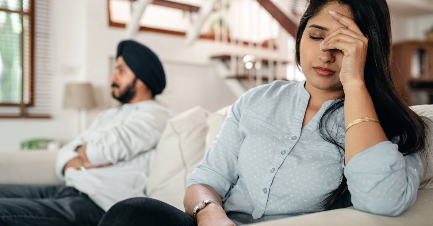 Worried person puts hand on their face