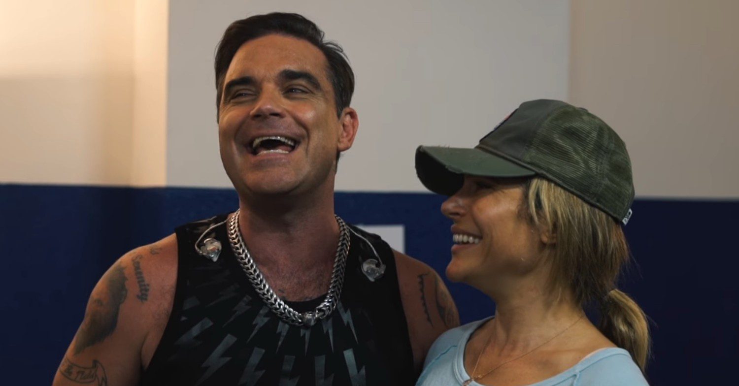 Robbie Williams and Ayda Field smiling together 