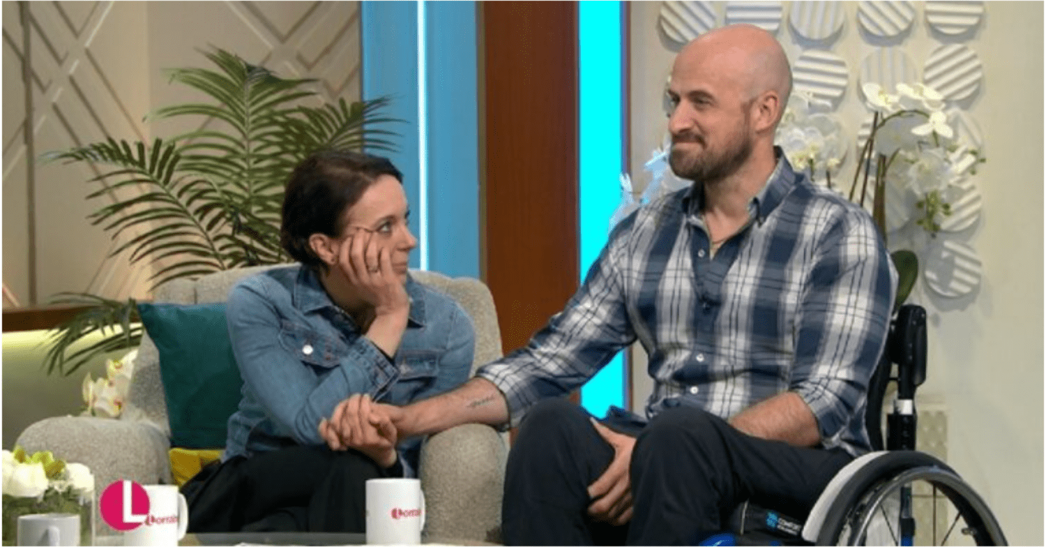 Amanda sits by Jonathan, who is in a wheelchair