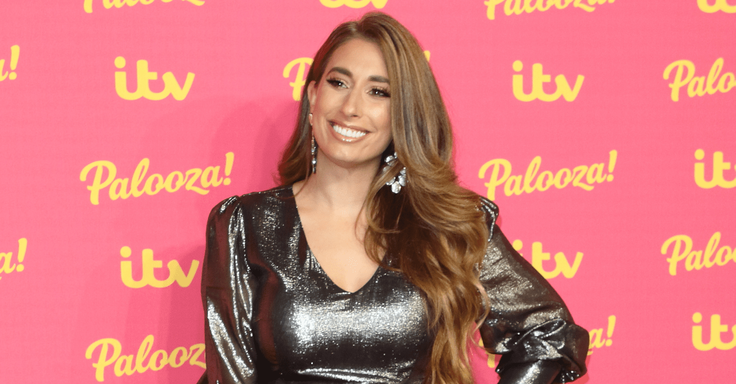 Stacey Solomon wears a metallic dress on a pink ITV bacdrop