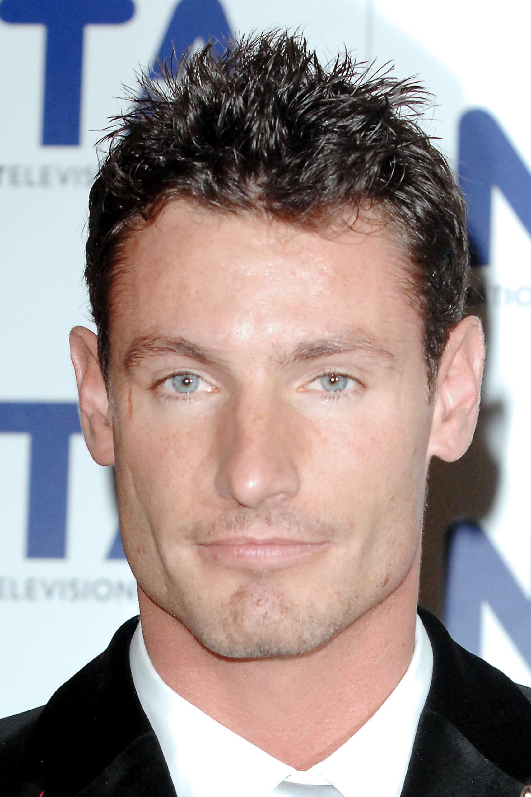 Dean Gaffney smiling at event