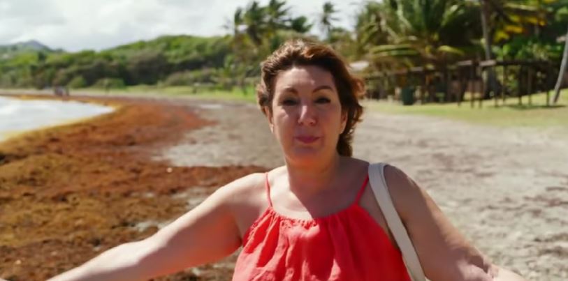 Jane McDonald at a beach in the Caribbean 
