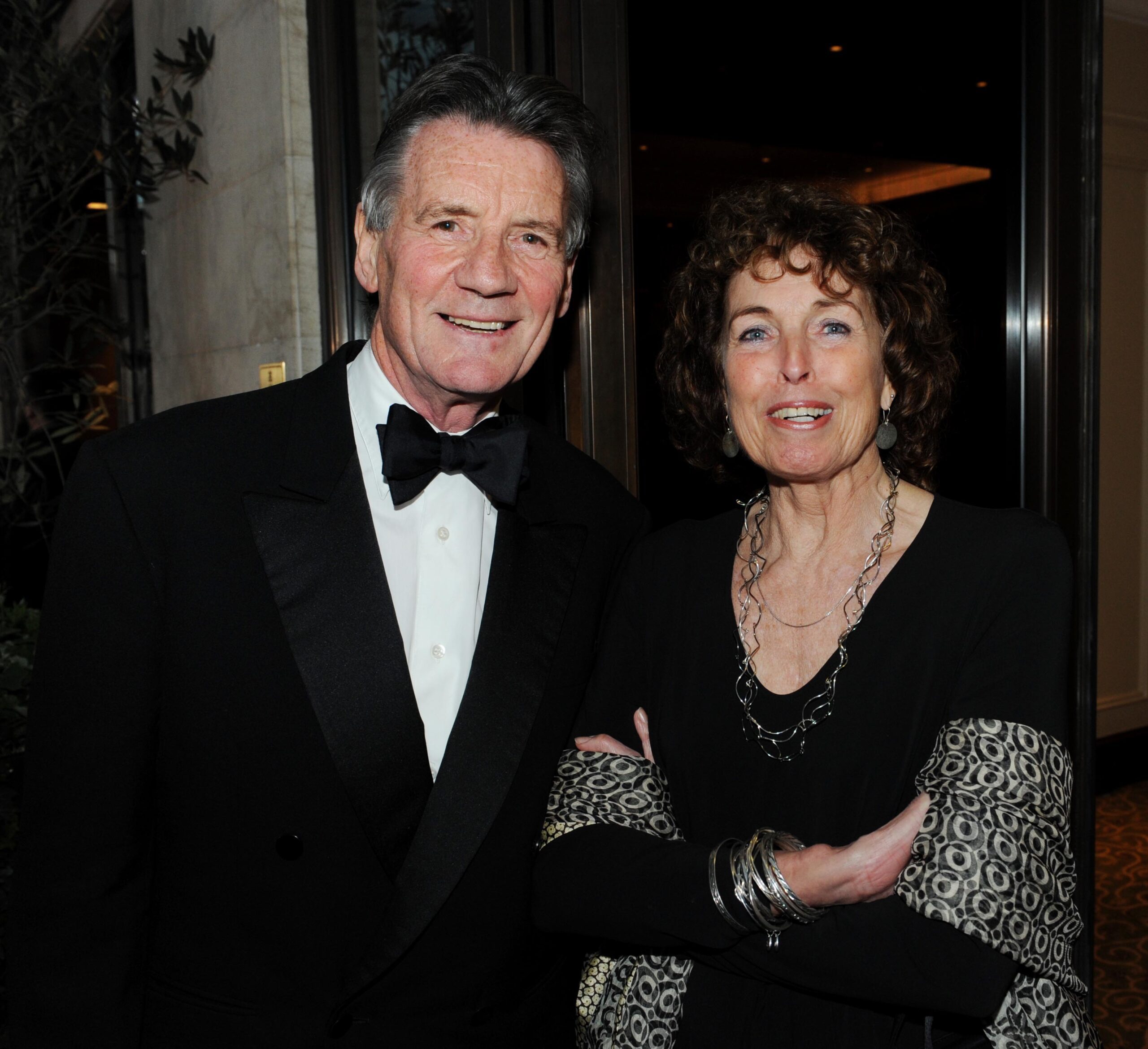 Michael Palin and his wife Helen smiling at event