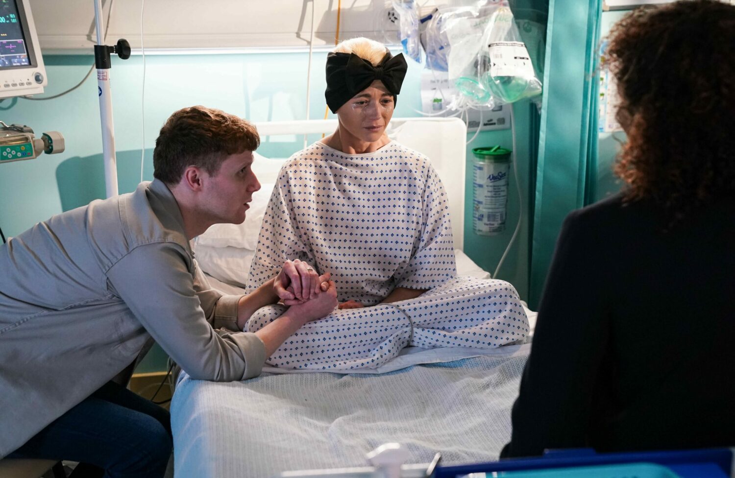 EastEnders' Lola is crying on her hospital bed whilst holding Jay's hand