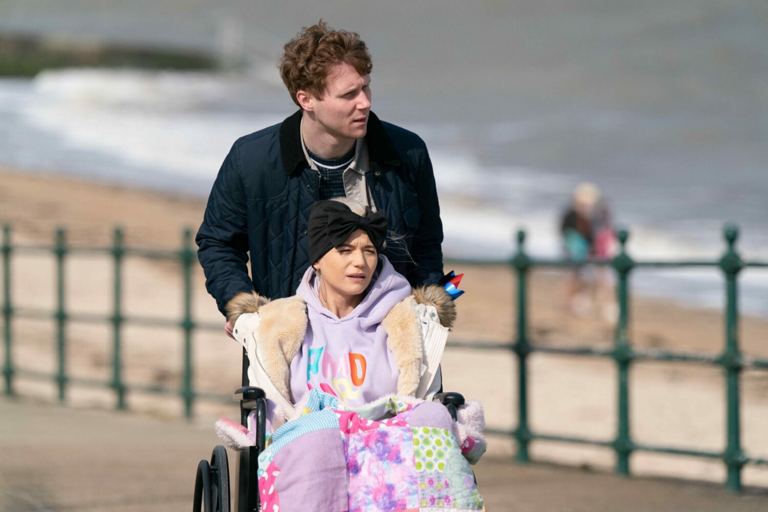 EastEnders' Jay is pushing Lola's wheelchair on the beach