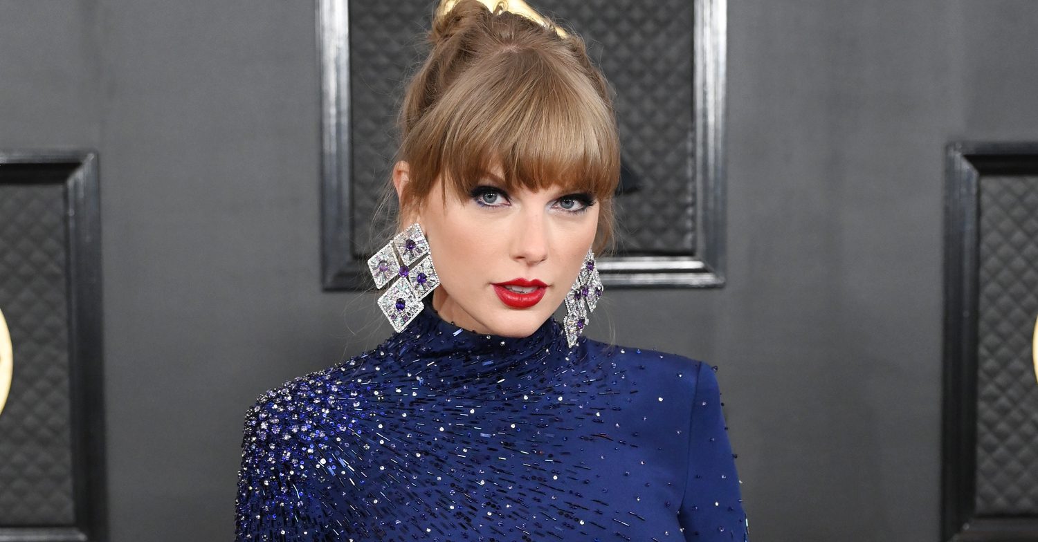 Taylor Swift smiles at the Grammy Awards