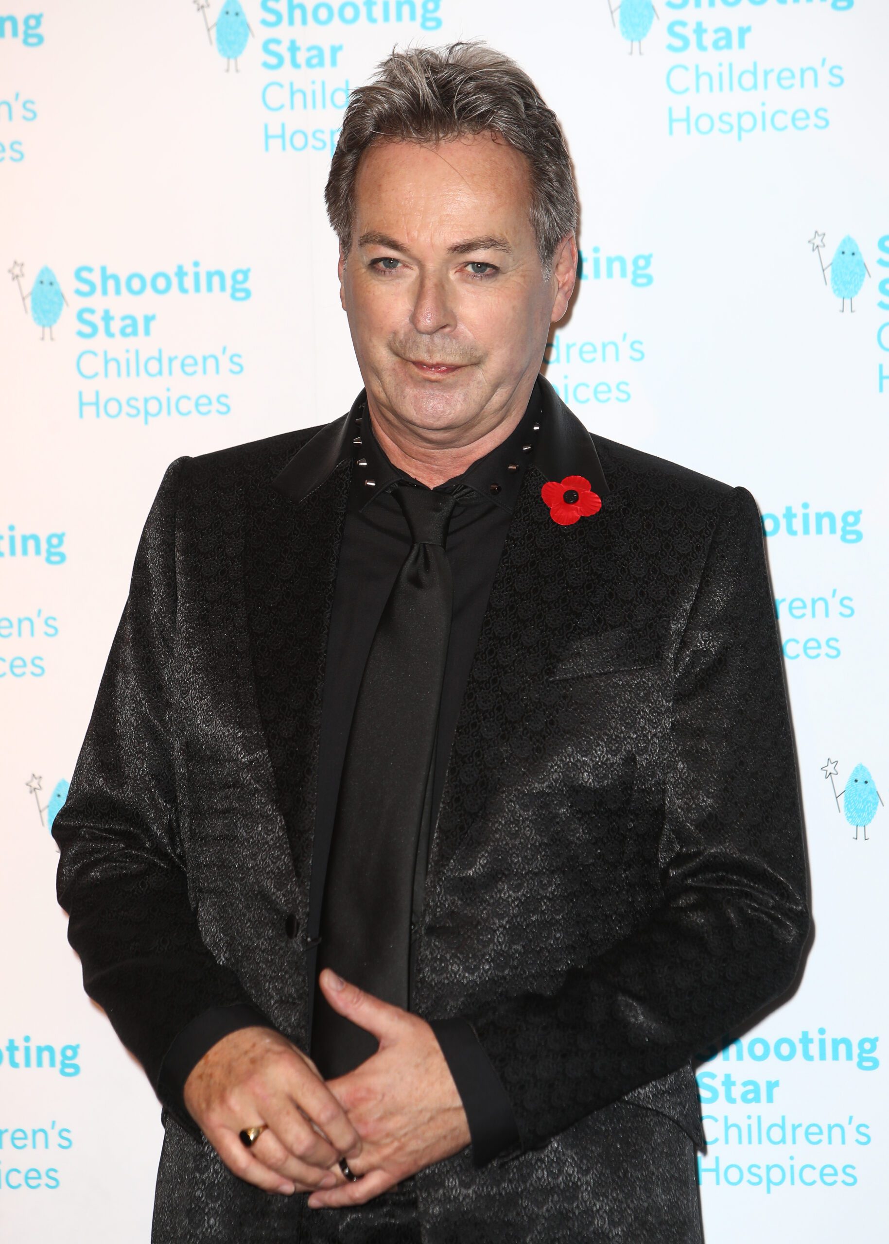 Julian Clary smiles at Shooting Star Ball 2021