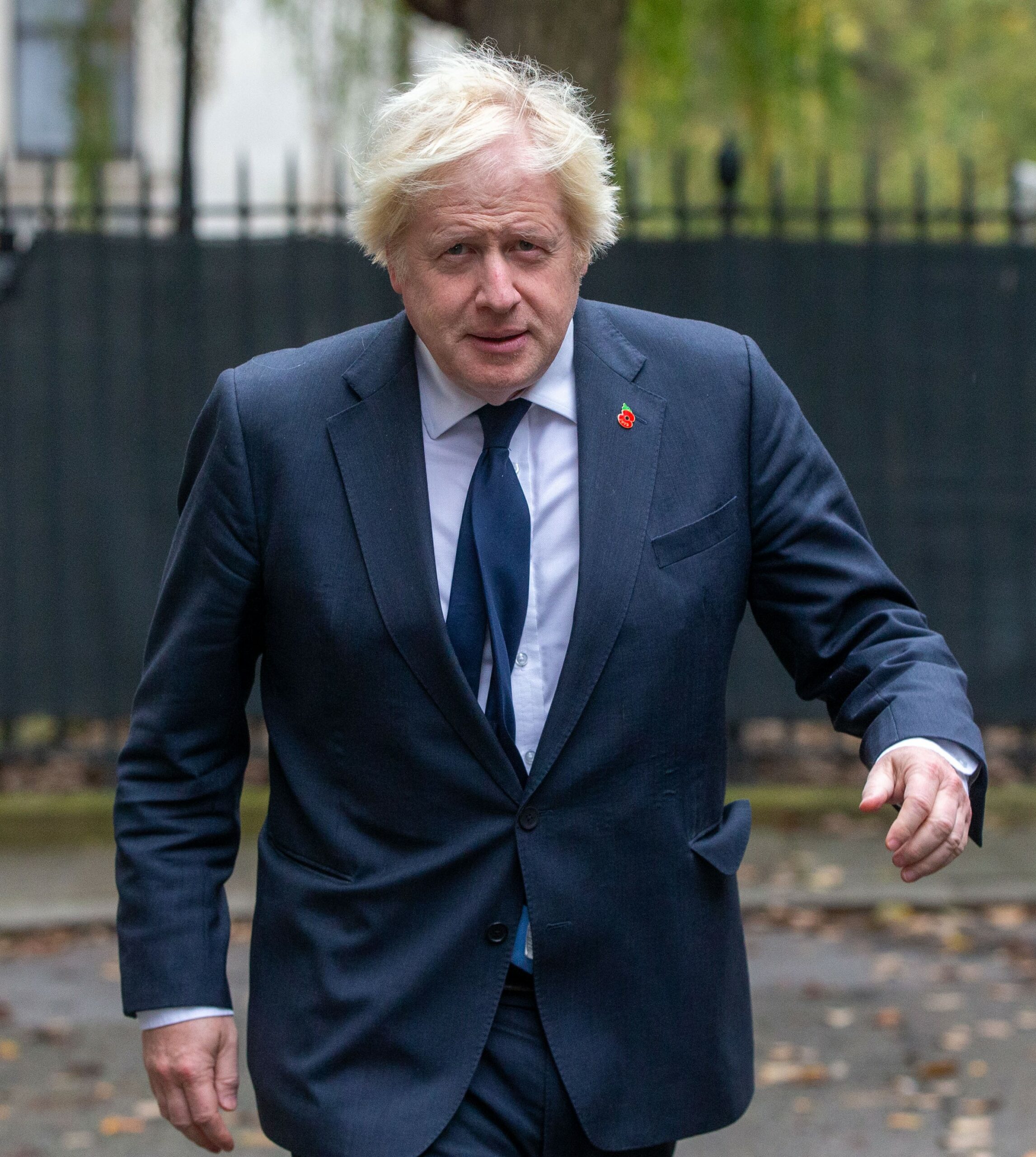 Boris Johnson walking in suit