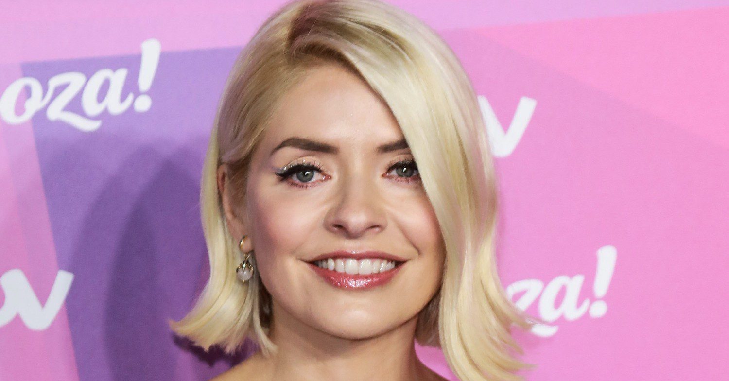 Holly Willoughby smiles on the red carpet