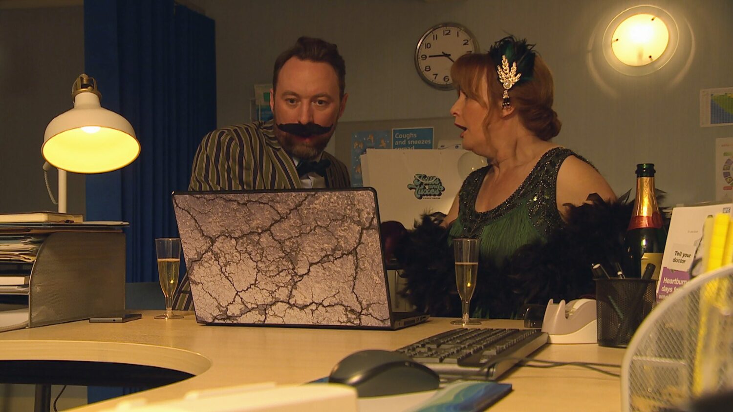 Liam and Wendy sit behind a computer on Emmerdale