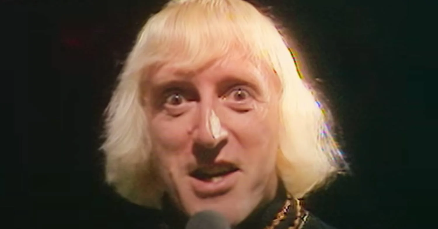 Jimmy Savile leering at the camera 