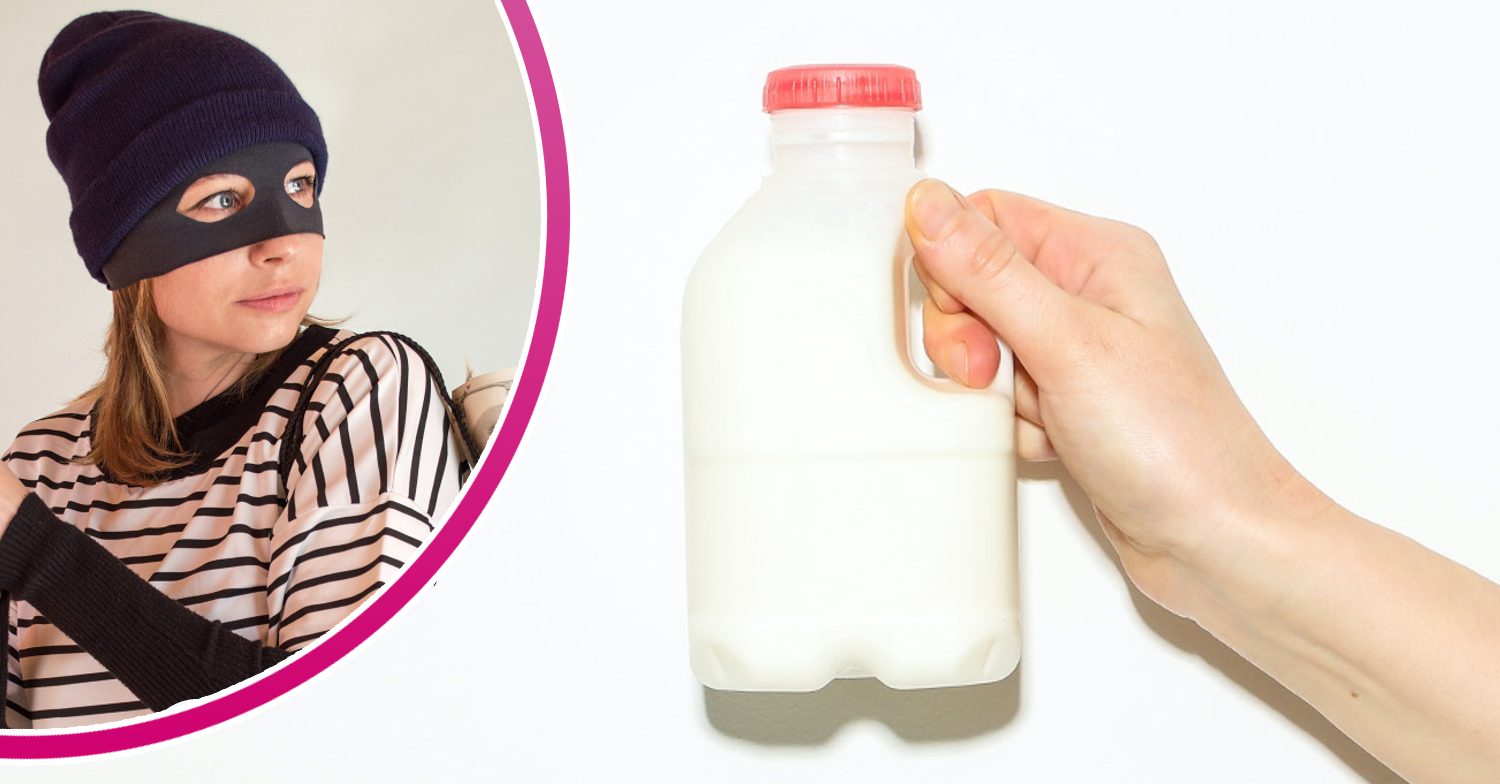 A thief poses next to a milk carton