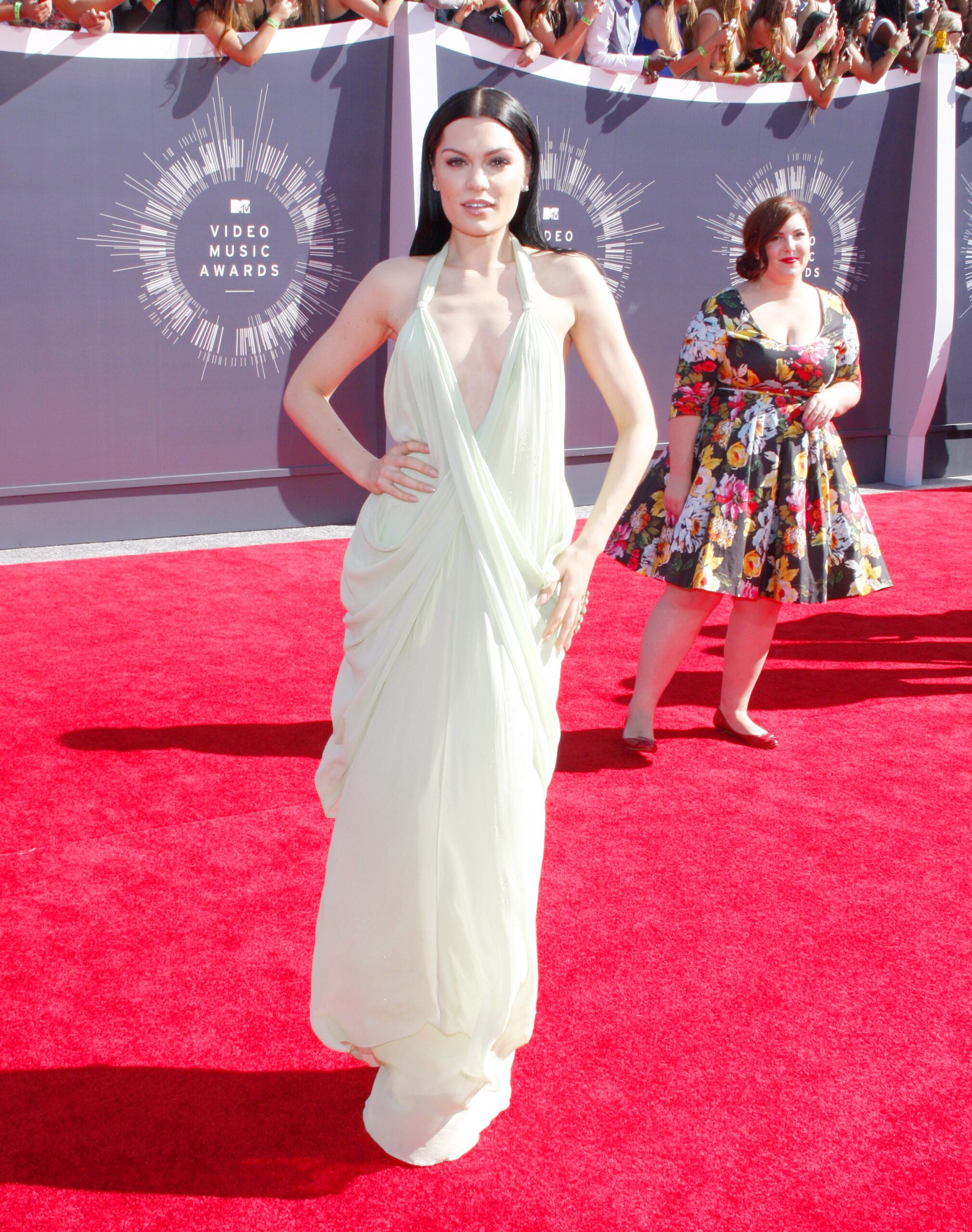 Jessie J on the red carpet in a cream dress