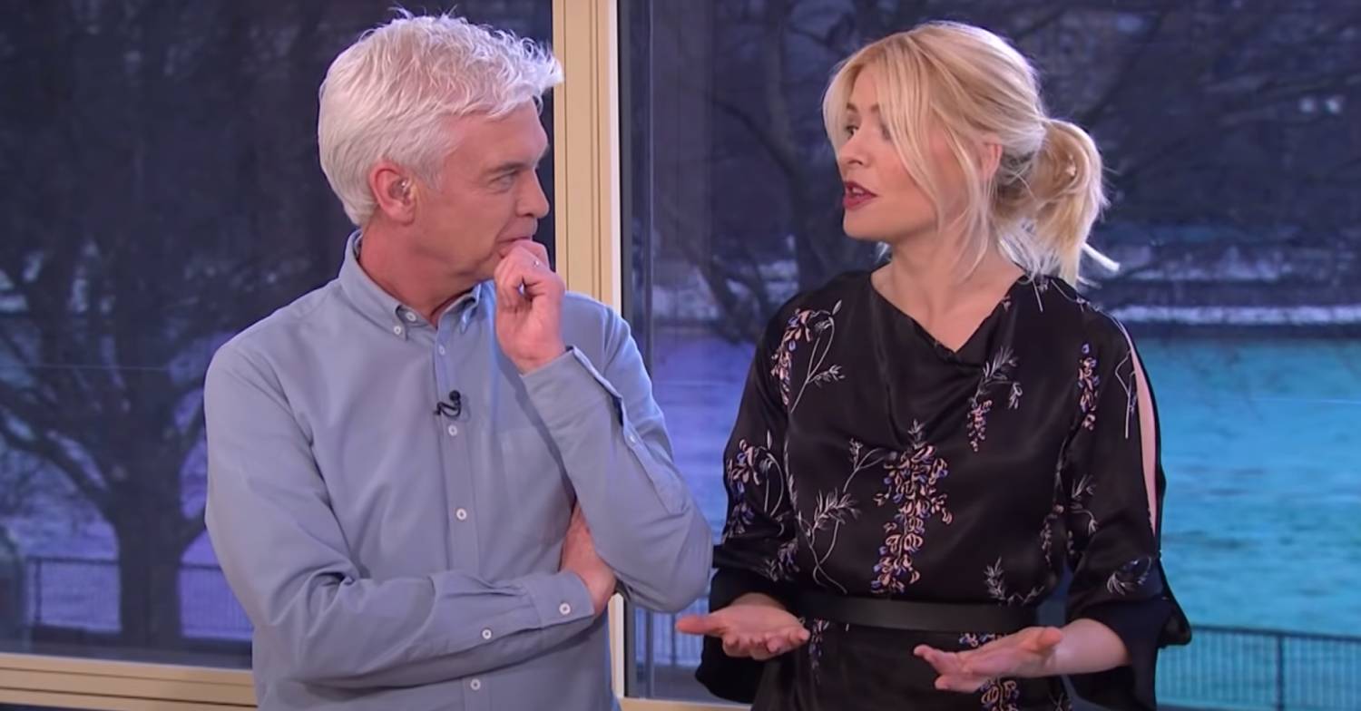 Phillip Schofield discusses a matter with Holly Willoughby