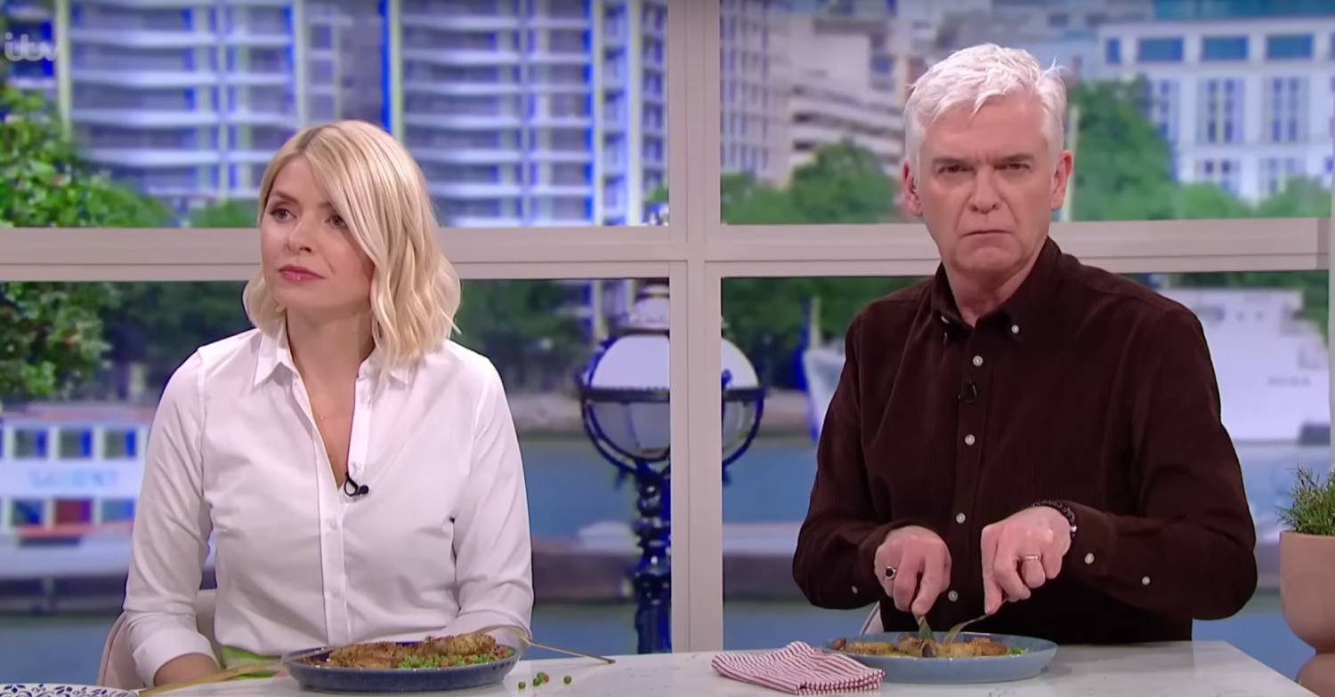 Phillip Schofield looks puzzled as he sits with Holly Willoughby