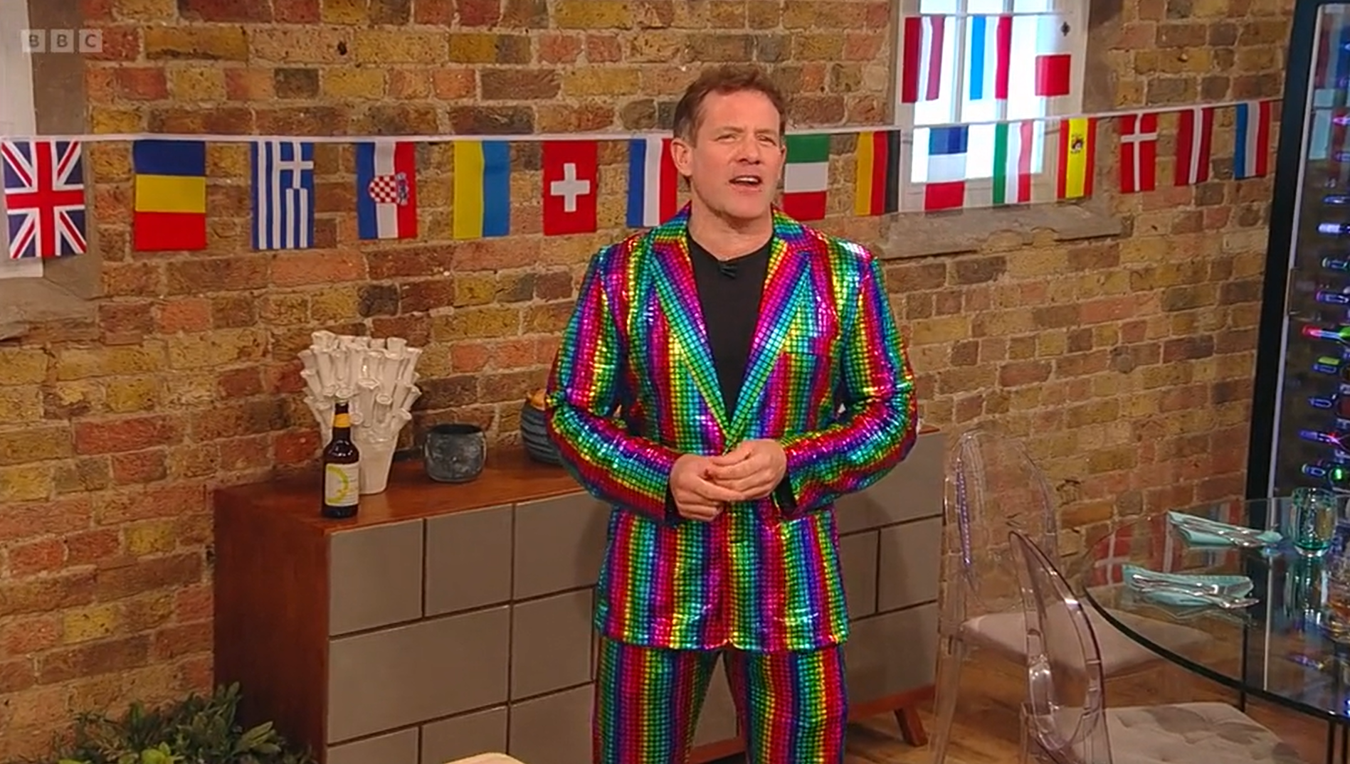 Matt Tebbutt in a sparkly colourful suit as he hosts Saturday Kitchen on the BBC ahead of Eurovision
