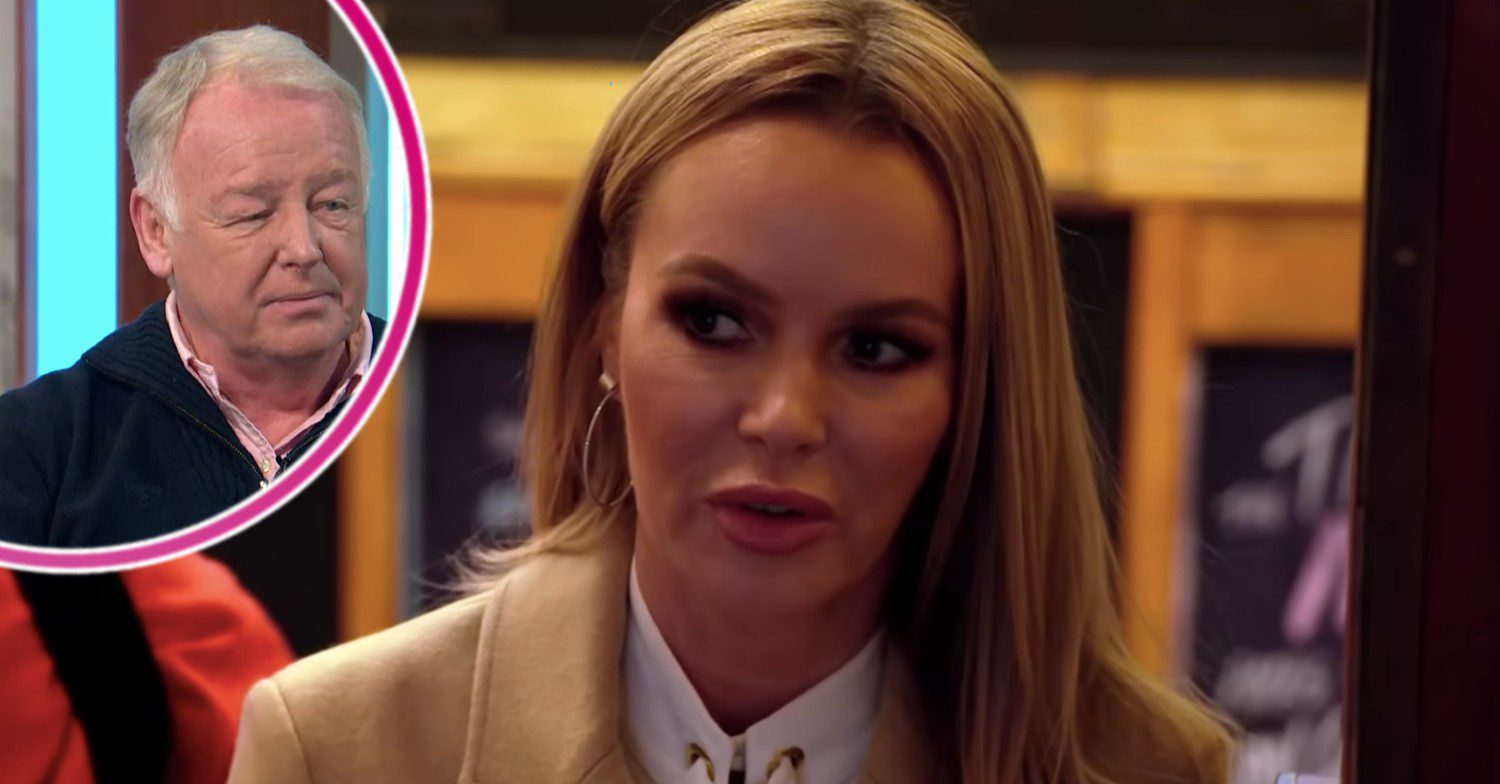 Les Dennis smirking with Amanda Holden looking serious