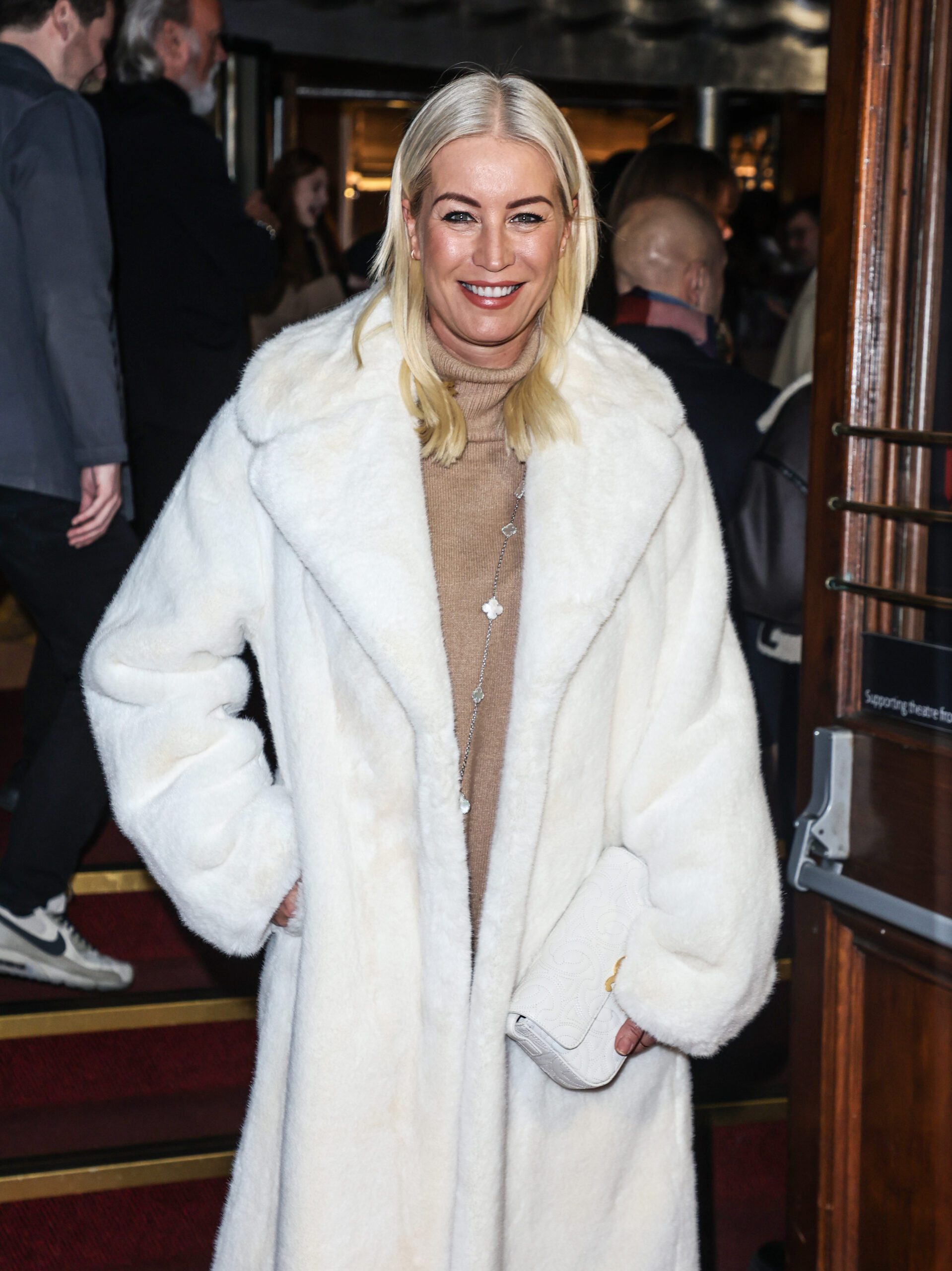 Denise Van Outen smiling at event