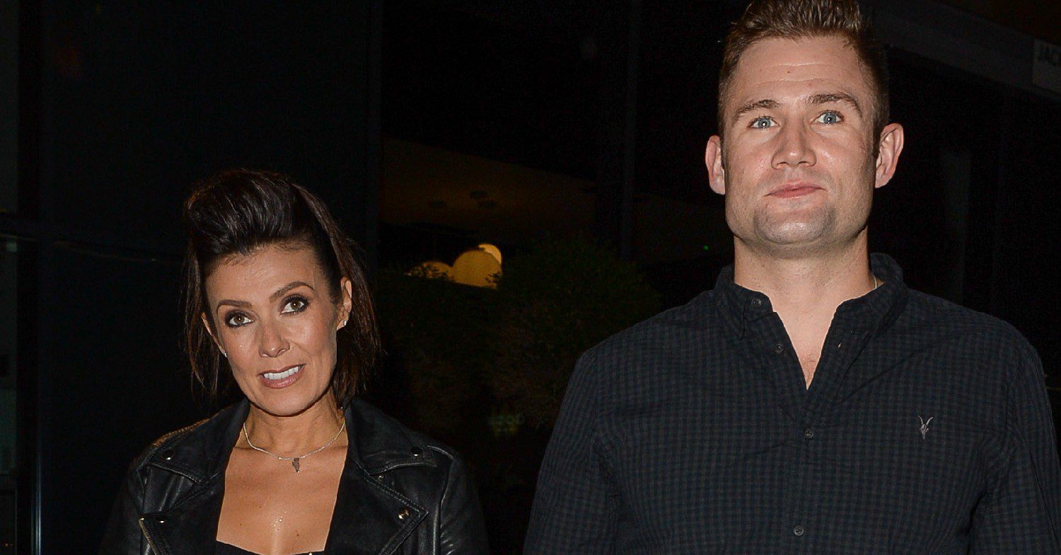 Kym Marsh and her husband Scott walking outside 