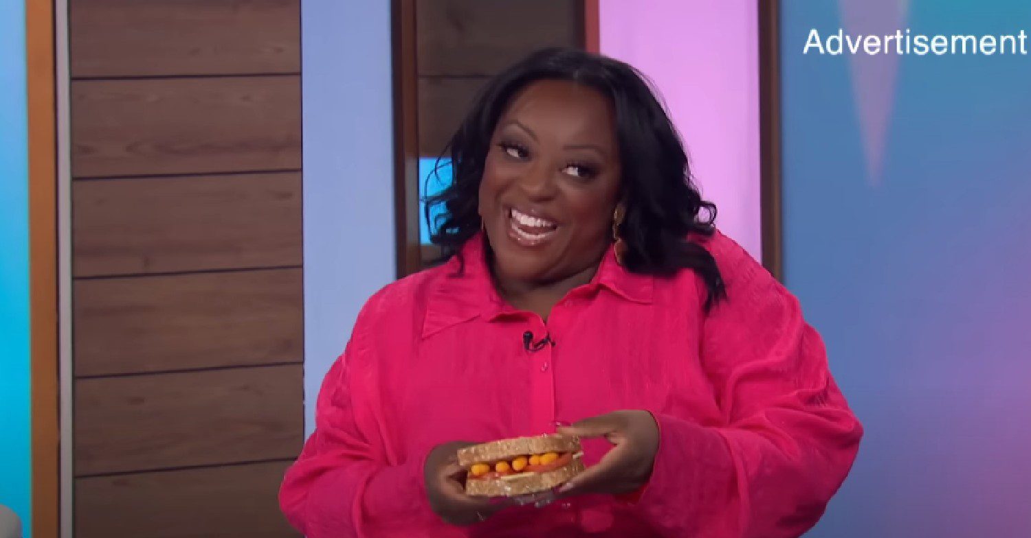 Judi Love grinning with crisp sandwich on Loose Women today