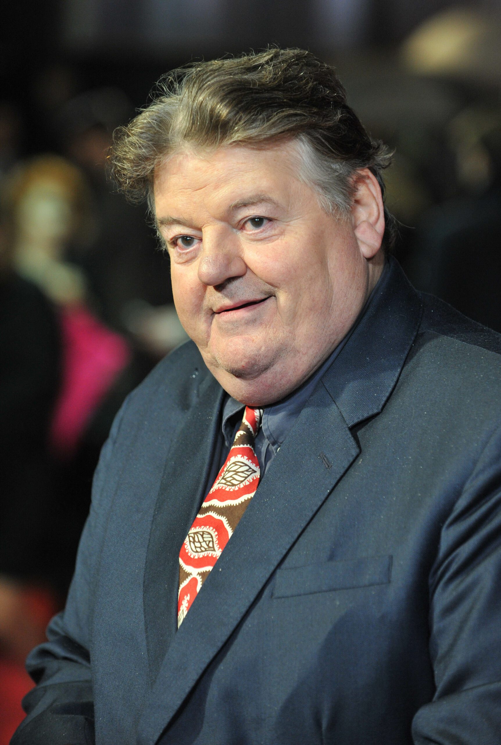 Robbie Coltrane smiles in 2012