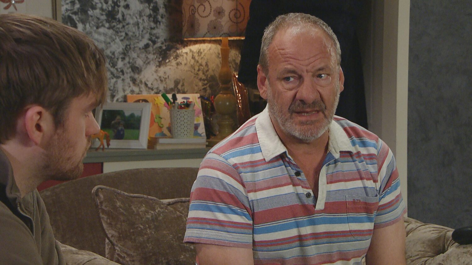 Emmerdale's Jimmy is looking at Tom with apprehension