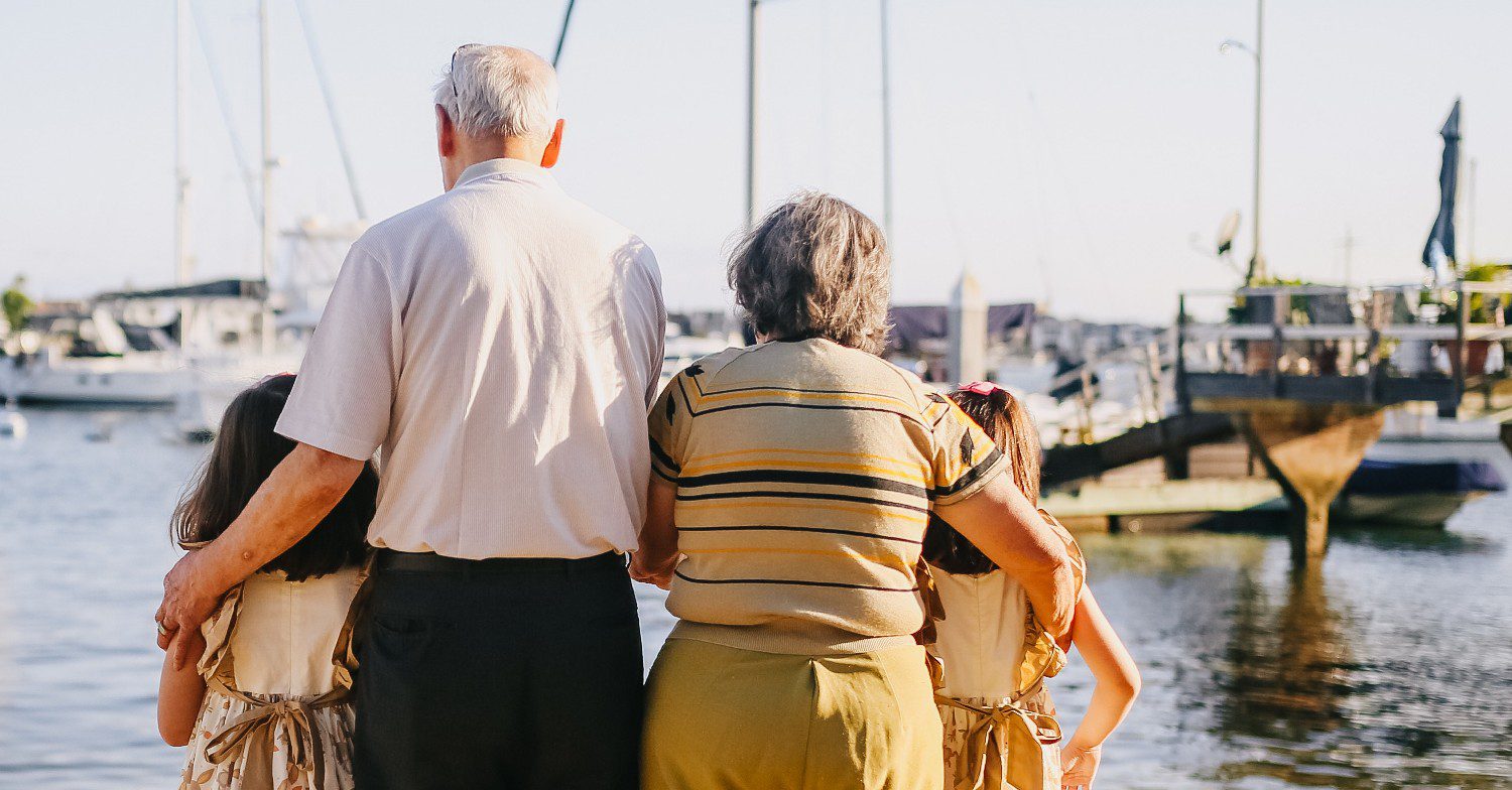 Uk news: Grandparents looking out at sea with their grandchildren