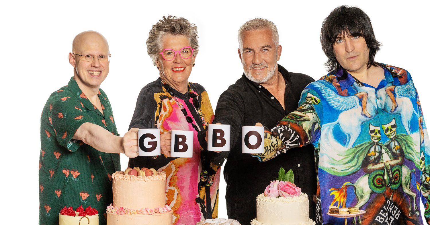 Great British Bake Off stars posing together smiling