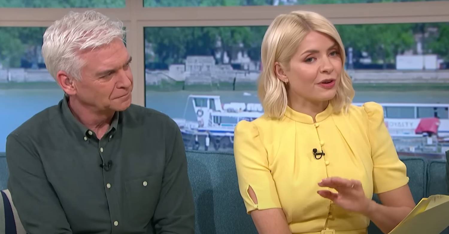 Phil and Holly sit next to each other