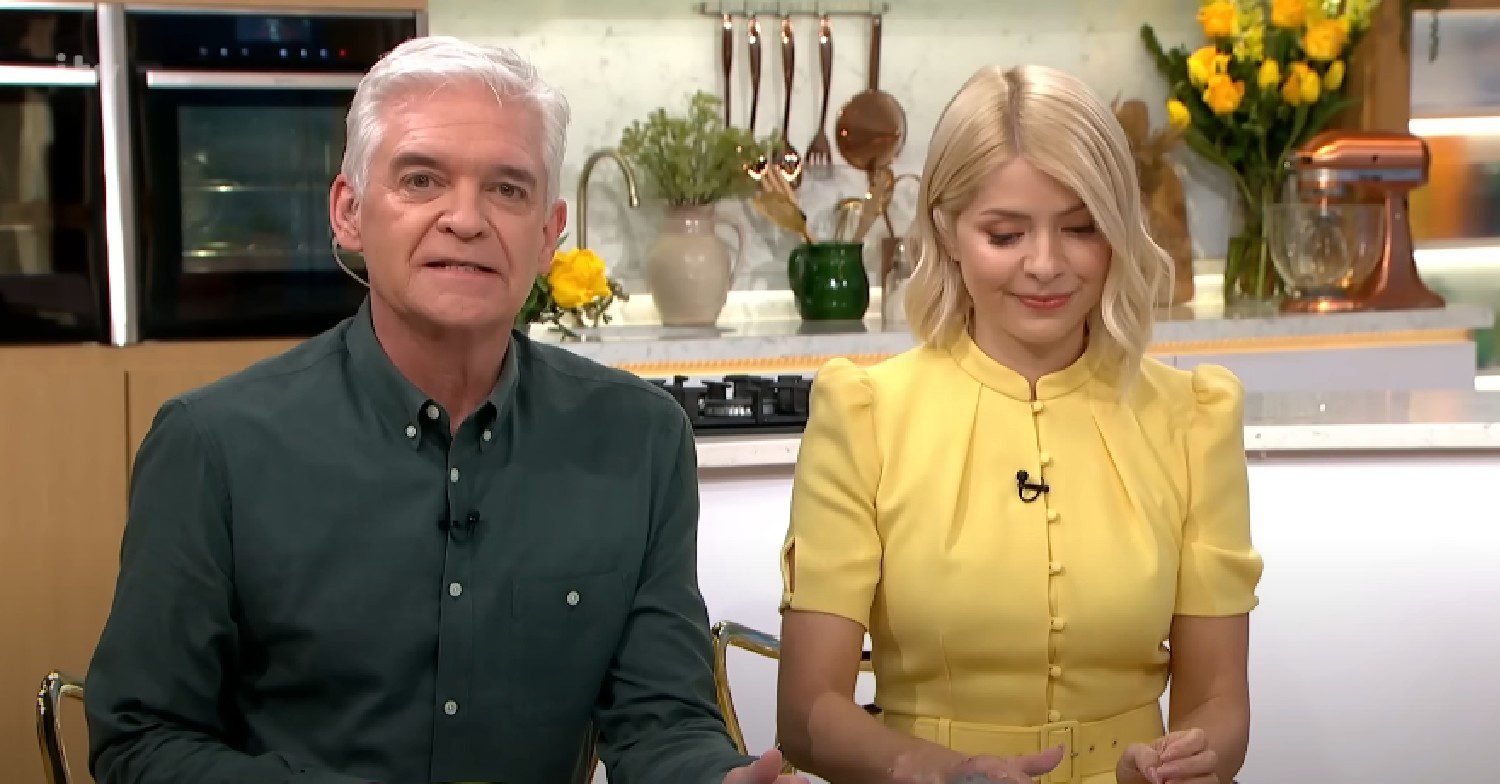 Phillip Schofield talks as Holly Willoughby looks down on This Morning