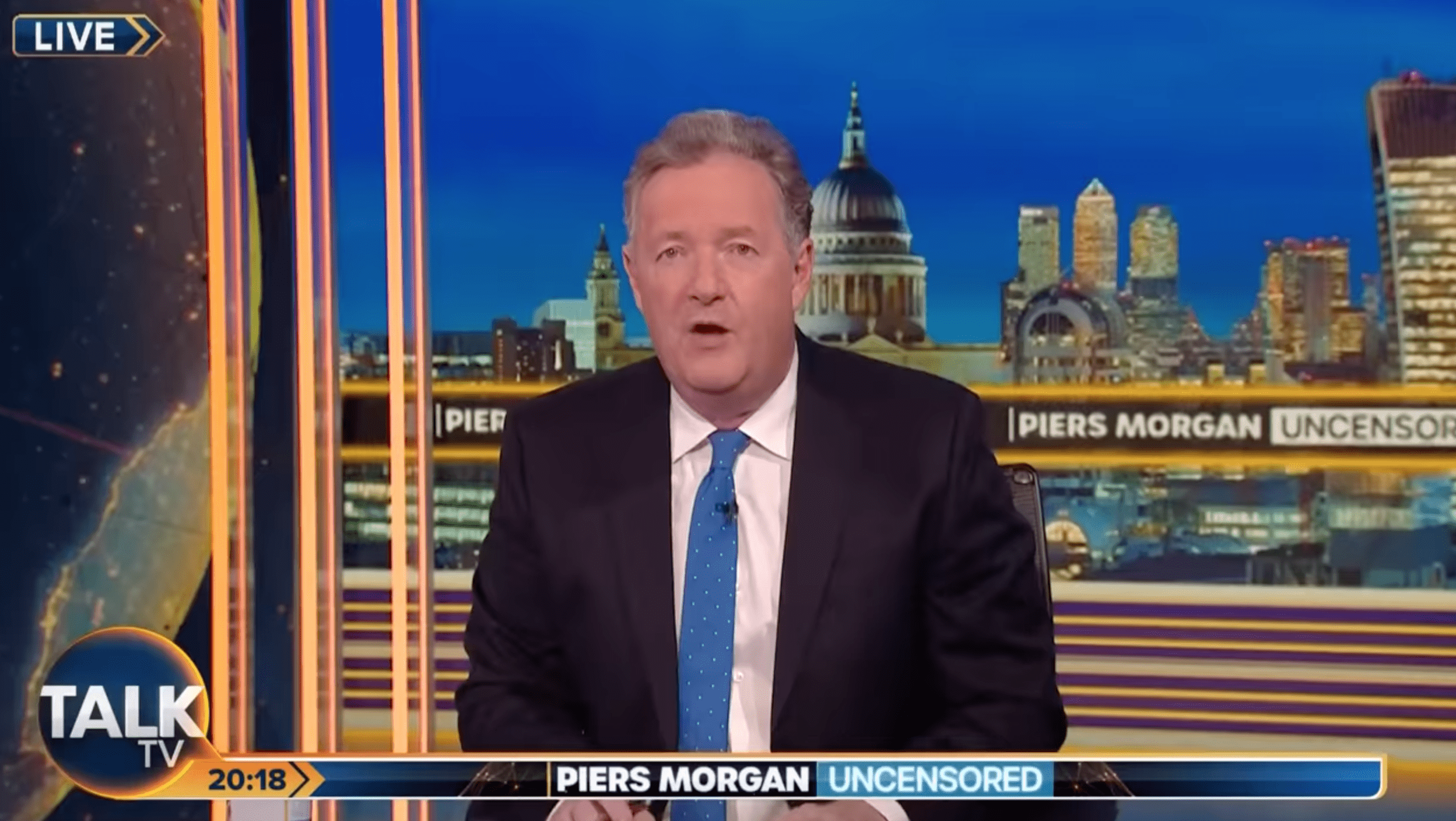 Piers Morgan fronting his Talk TV show looking shocked