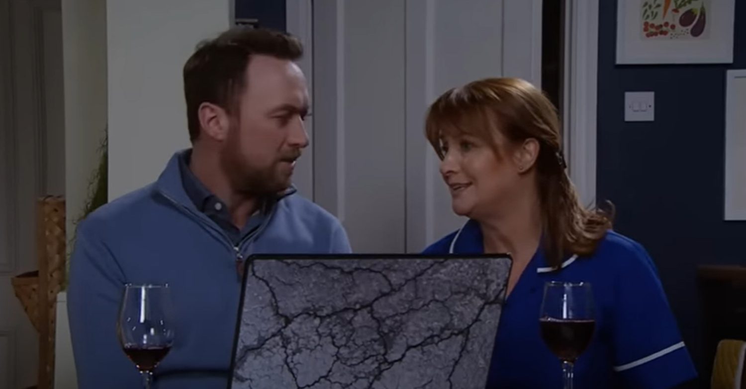 Emmerdale's Liam and Wendy are sitting in front of the laptop together