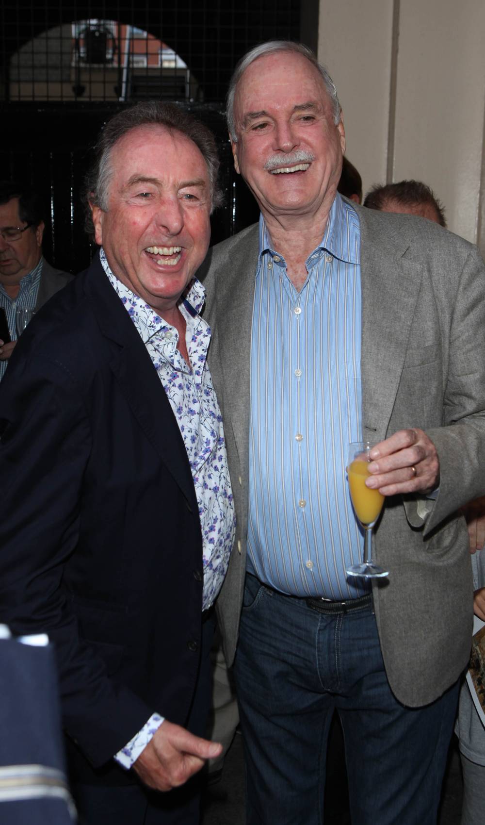 John Cleese and Eric Idle smile together in 2013