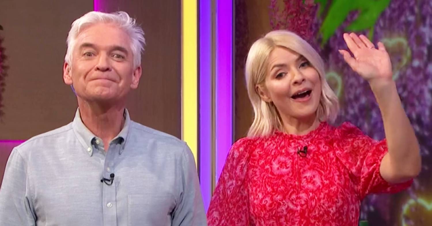 Phillip Schofield lifts his chin, Holly Willoughby waves