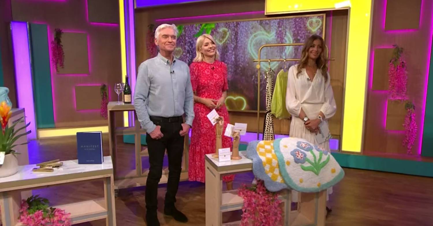 Phillip Schofield stands next to Holly in his final appearance on This Morning