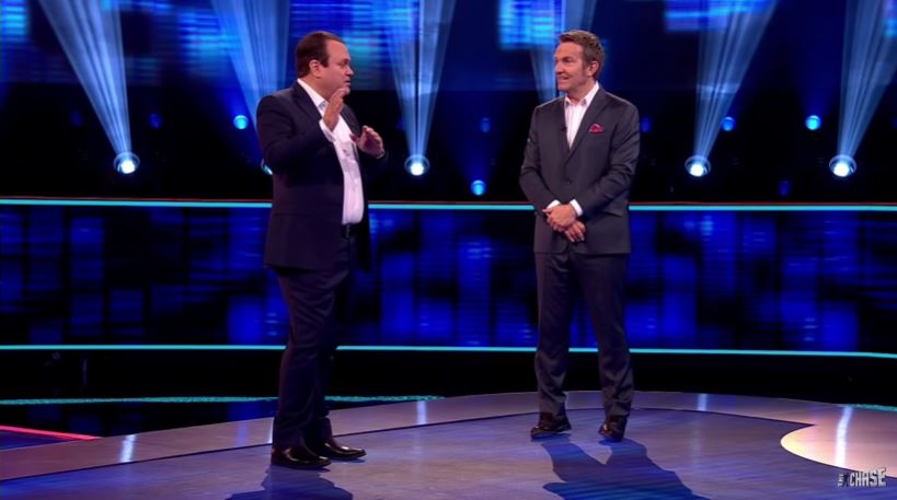 Shaun Williamson talking to Bradley Walsh on the stage of The Chase 