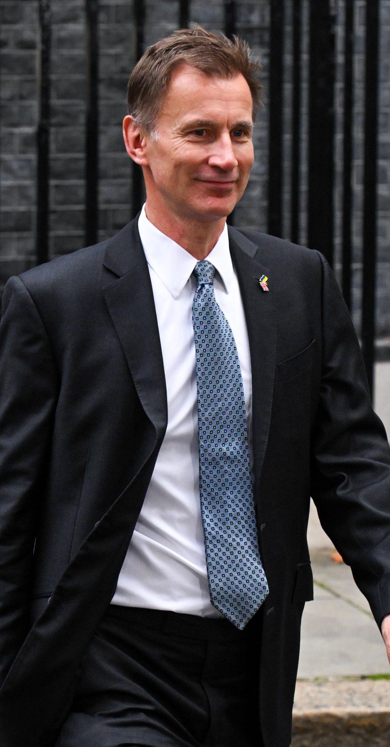 Jeremy Hunt smiling leaving Downing Street