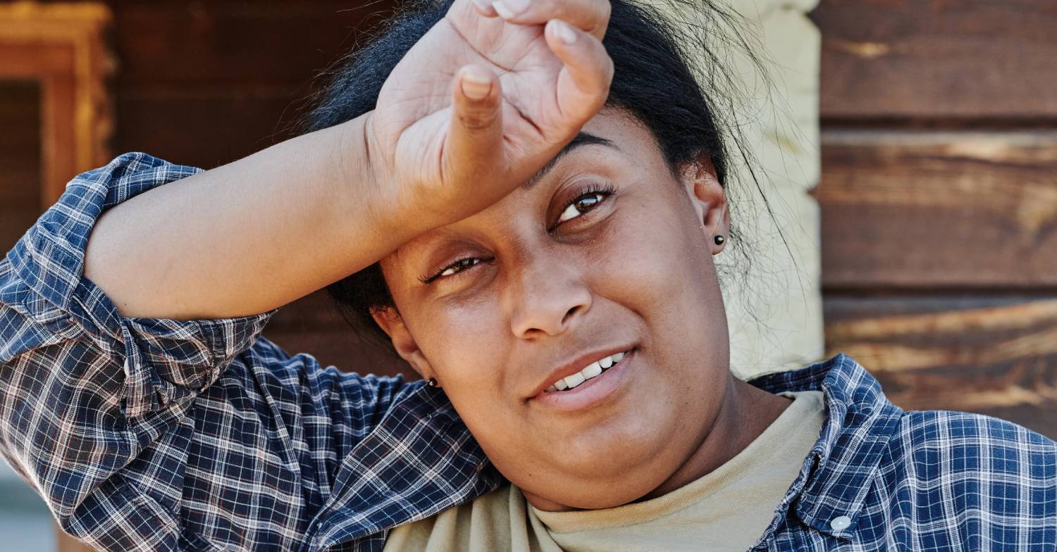 Women wipes her forehead