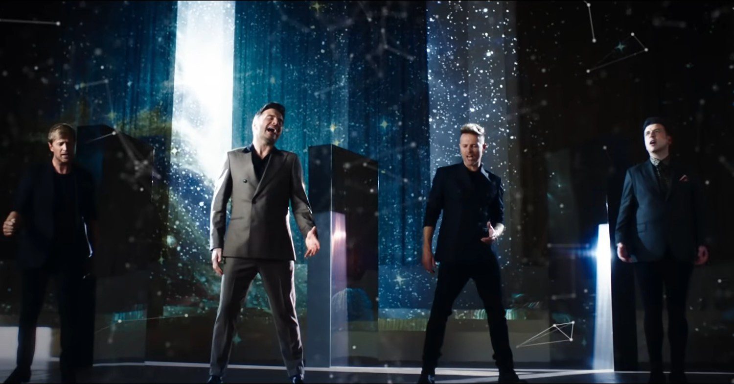 Westlife singing in a music video